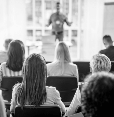 An audience listening to a speaker